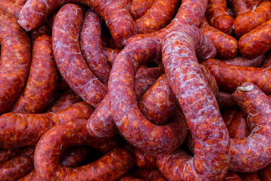 Background with delicious raw peppered pork sausage