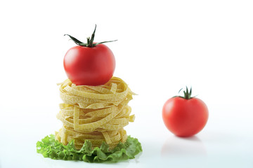 Pasta with tomatoes on a white background