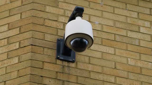 Survelliance camera on wall controls the city