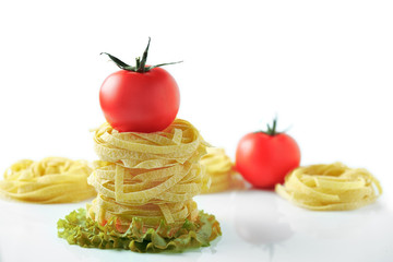 Pasta with tomatoes on a white background