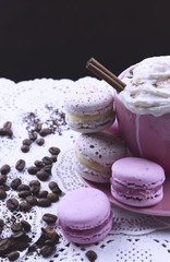 A cup of cappuccino and macaroons