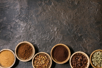 Variety of grounded, instant coffee, different coffee beans, brown sugar in wooden bowls in row...
