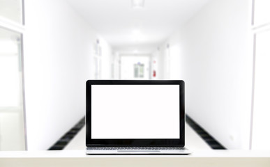 Copy space Screen Laptop on table in White building