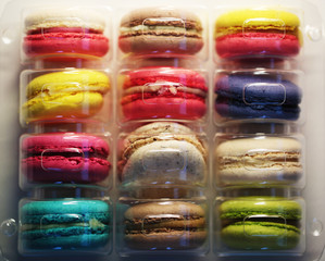 Macaroons of different colors packed in plastic bag