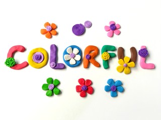 Beautiful colorful text made from plasticine clay dough decoration variety flowers on white background