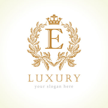 Luxury E letter and crown monogram logo. Laurel elegant beautiful round identity with crown and wreath. Vector letter emblem E for Antique, Restaurant, Cafe, Boutique, Hotel, Heraldic, Jewelry