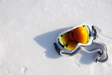 the photographer's reflection in snowboarder glasses