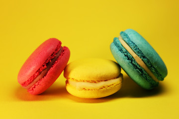 Bright food photography of macroons on yellow background