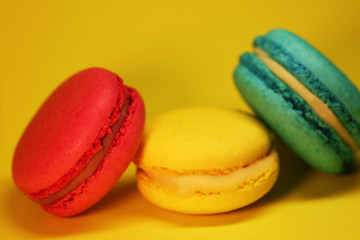 Bright food photography of macroons on yellow background