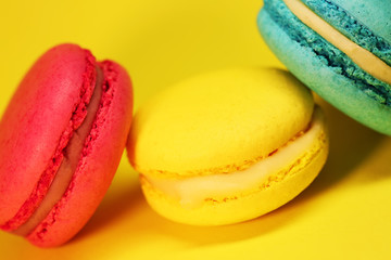 Bright food photography of macroons on yellow background