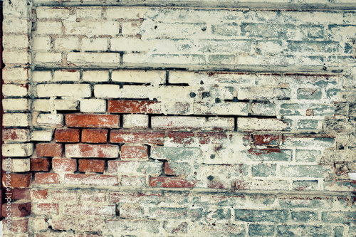 Old Brick Wall Of Red And White Covered With Plaster In Some Old Brick Wall Of Red And White Covered With Plaster In Some Places