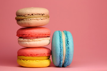Bright food photography of macroons on pink background