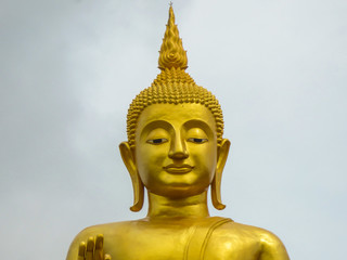 Fototapeta premium Head of the golden Buddha statue at Hat Yai Park - Thailand