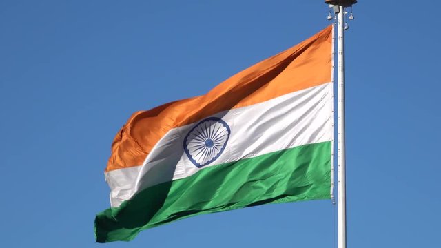 Large Indian flag flying in wind at Shimla, India 