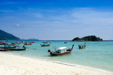 Fototapeta na wymiar Sand and Andaman sea background, tropical beach travel concept. Koh Lipe, Satun, Thailand