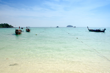 Fototapeta na wymiar Sand and Andaman sea background, tropical beach travel concept. Koh Lipe, Satun, Thailand