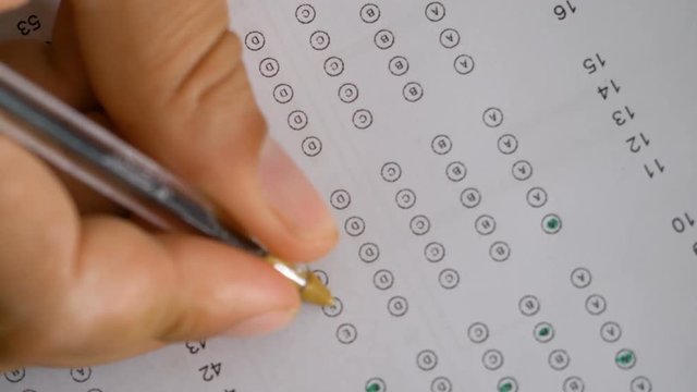 Student's handful compiles the multiple-choice test