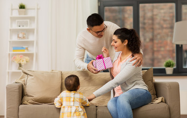 happy family with birthday present at home