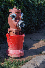 Fototapeta na wymiar old street fire hydrant to extinguish a fire closeup