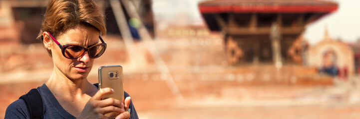 Tourist Taking a Photo with Smartphone, Bhaktapur Durbar Square, Nepal