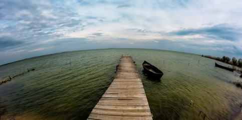 Razelm Lake view with a bridge and boats, Sarichioi, Romania
