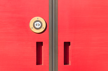 Modern red electric train wagon sliding doors with sensor button for opening close up technology concept