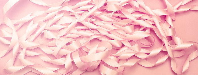 Banner A coil of decorative satin ribbons of pink color.