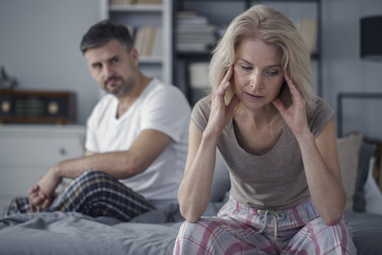 Woman with headache and husband