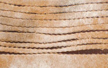 Background of trenette pasta, beige color and lines