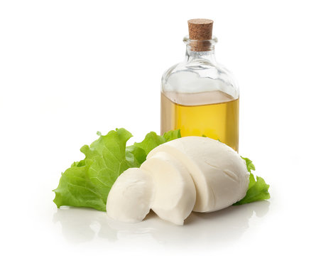 Sliced mozzarella ball white lettuce and olive oil