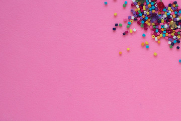 colorful beads on pink backround