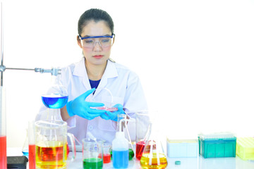 Asian female medical technologist working with chemical in research laboratory
