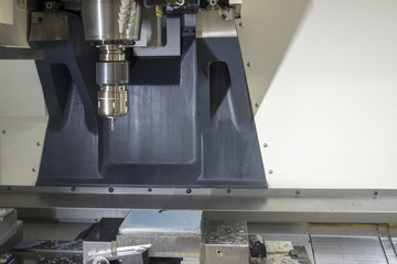 The CNC milling machine cutting the sample part.The special holder attach on the spindle of CNC machine.