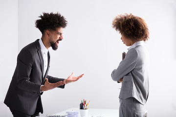 Businessman Shouting At Female Executive