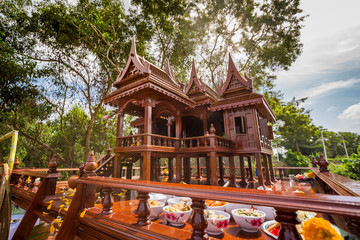 Beautiful Thai style spirit house or house of the guardian spirit is made of wood and sculptured...