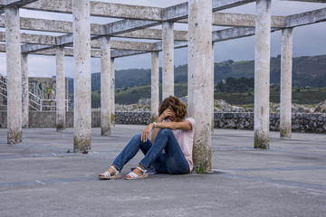Mature woman, with a depression, sitting in a public place