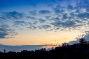 landscape, sunset or sunrise, the sky covered with picturesque clouds