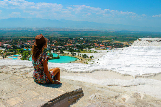 Woman take a picture of beautiful hill and village nature top view in Turkey