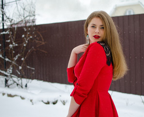 Young smiling girl in the winter