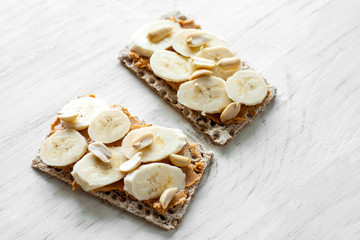 Healthy snack - vegetarian bread loaf with peanut butter and banana