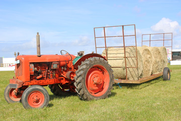 vintage tractor with hay bales