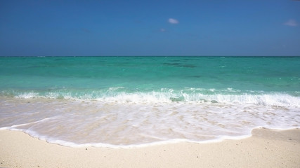 Tropical beach with white sand with beach house on a tropical island. Beautiful sky, sea. Seascape: Ocean and beautiful beach paradise. Philippines. Travel concept.