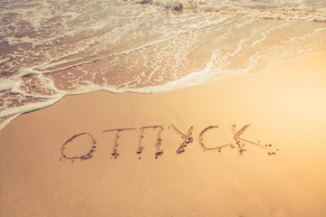 The inscription on the sand. Inscription on the bank of the ocean