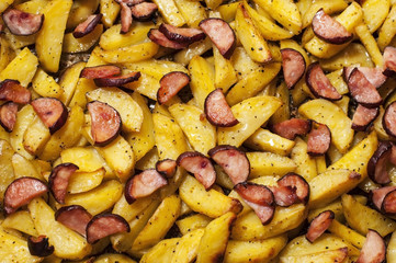 Baked potatoes with smoked sausages cooked at home