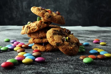 Gardinen Chocolate cookies with colorful candies. Chocolate chip smarties cookies. © beats_