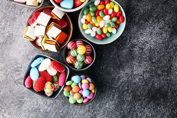 candies with jelly and sugar. colorful array of different childs sweets and treats