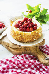 Home summer curd cheese cake with wild strawberries. Selective focus.