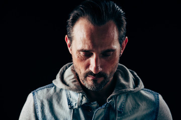 Fototapeta premium Close up image of sexy man with down look. Real man concept.