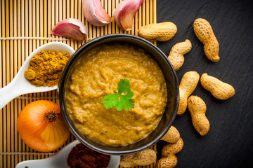 Spicy peanut sauce with garlic and onion. Perfect for satay. Top view.