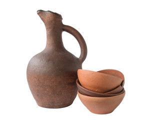 Georgian wine old clay jug with clay cup on white background, isolated